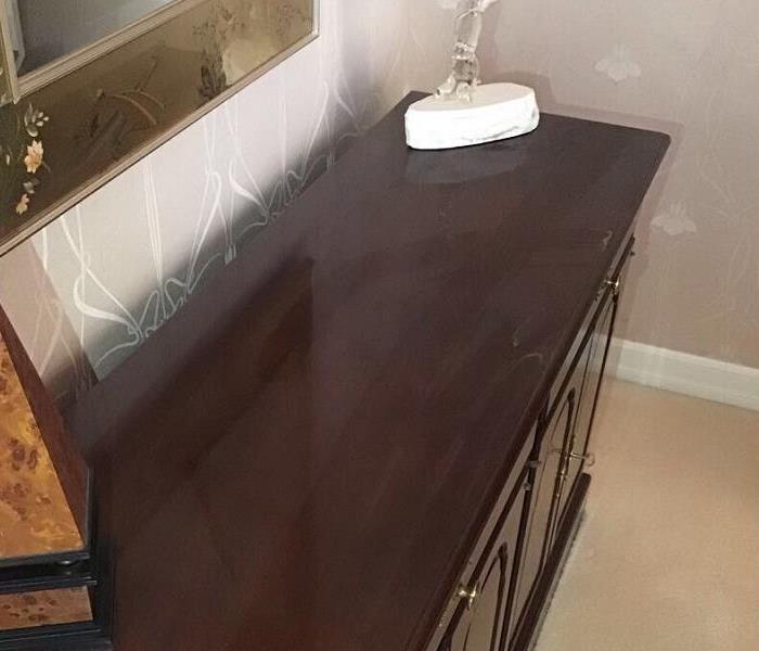The image shows concrete dust on top of a hutch table